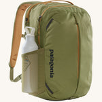 A Patagonia Refugio Day Pack 26L with a water bottle in the mesh side pocket