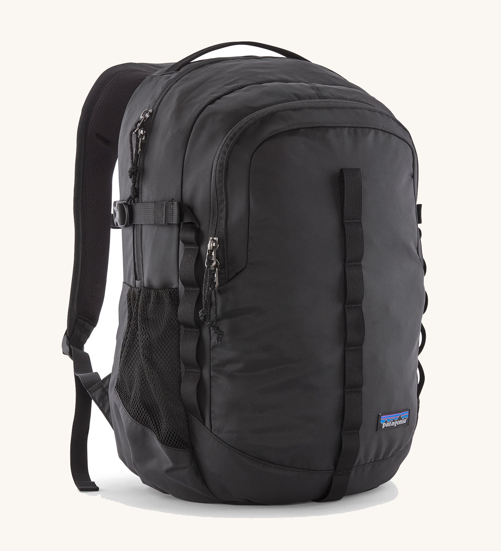 Patagonia refugio 26L back pack in black with matching black straps buckles and mesh side pockets