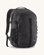 Patagonia refugio 26L back pack in black with matching black straps buckles and mesh side pockets