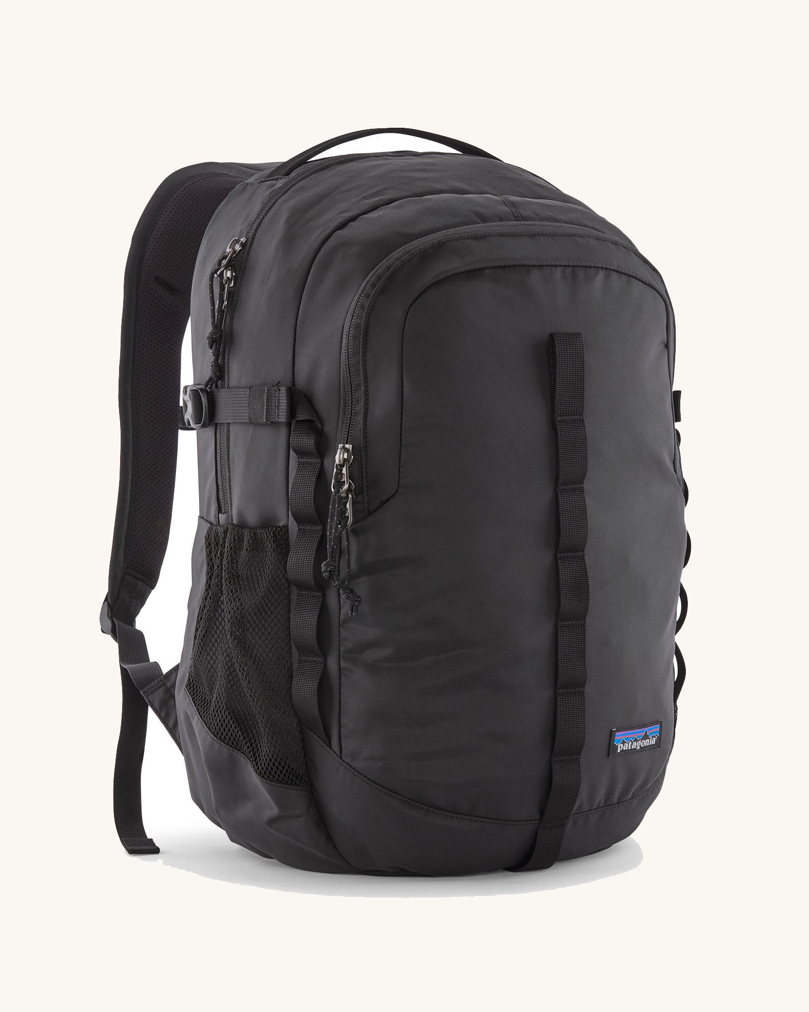 Patagonia refugio 26L back pack in black with matching black straps buckles and mesh side pockets