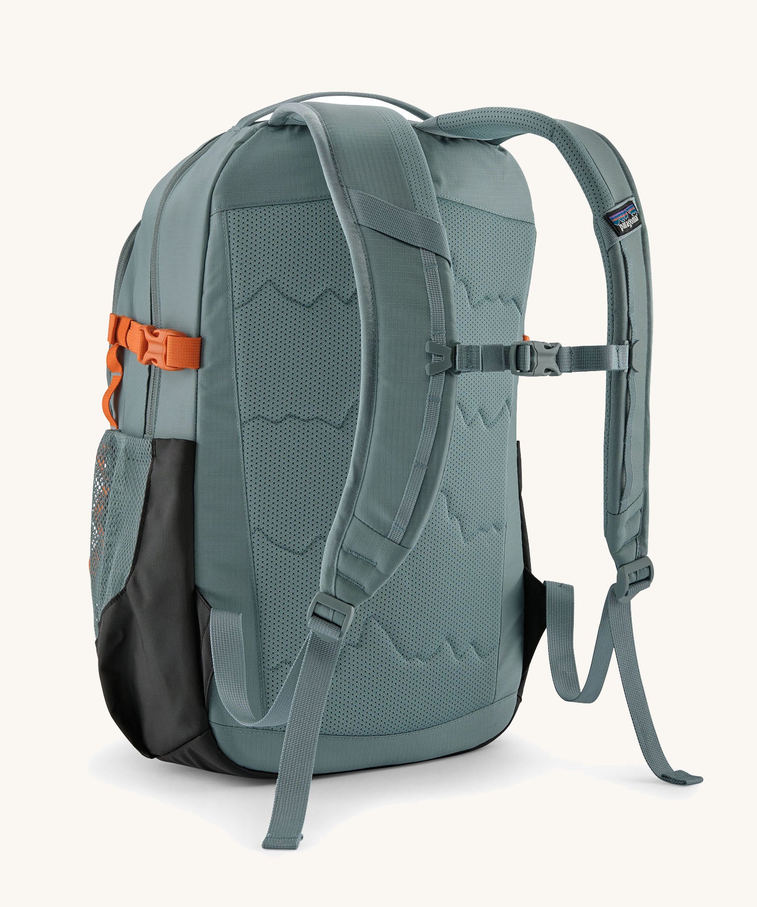 Back of the Patagonia 26L refugio backpack in sage blue with a chest strap and quick release buckle.