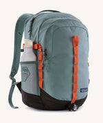 Patagonia refugio backpack insage blue with a bottle in the side mesh holder.
