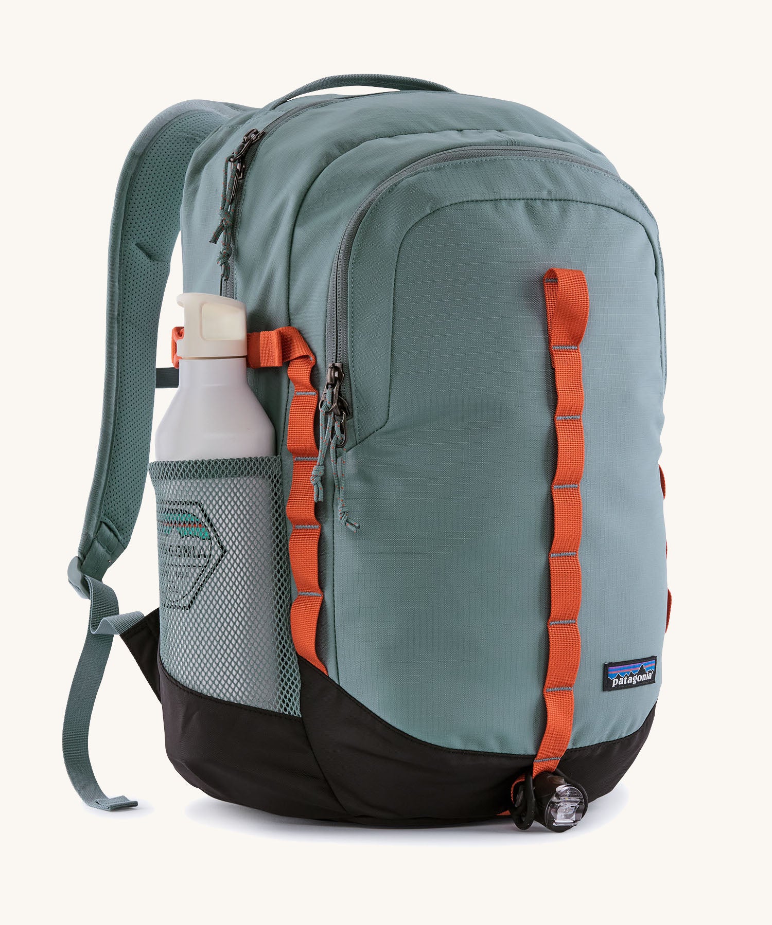 Patagonia refugio backpack insage blue with a bottle in the side mesh holder.
