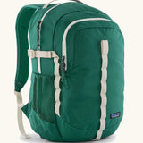 Patagonia refugio 26L back pack in green with cream straps buckles and green mesh side pockets