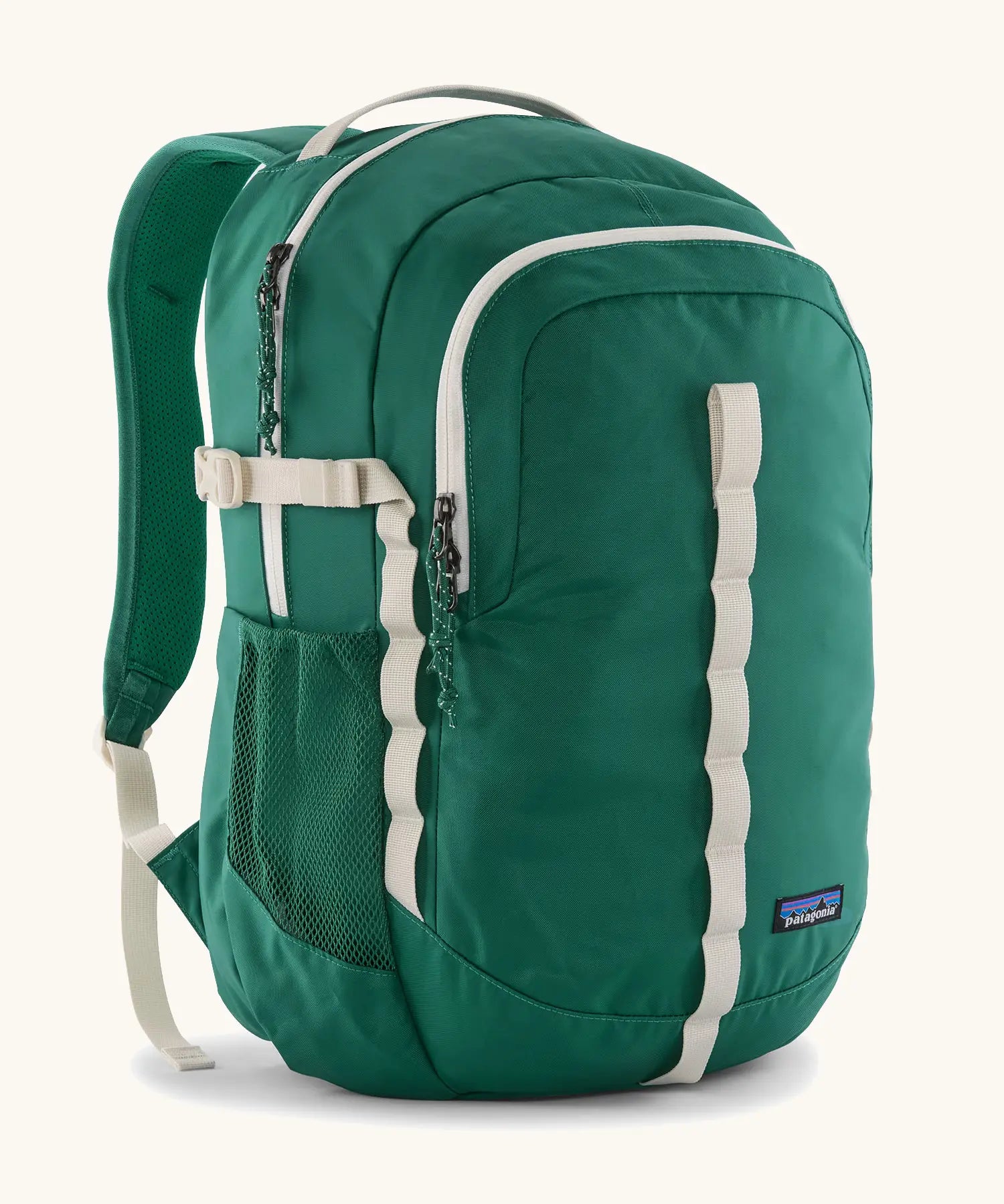 Patagonia refugio 26L back pack in green with cream straps buckles and green mesh side pockets