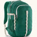 Patagonia refugio 26L back pack in green with cream straps buckles and green mesh side pockets