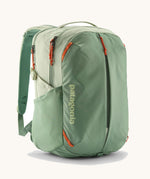 Patagonia refugito day pack 26 litres in lichen green. A 100% recycled material backpack in pastel green with orange detail. Features padded shoulder straps, mesh side pockets and 3 main compartments. 