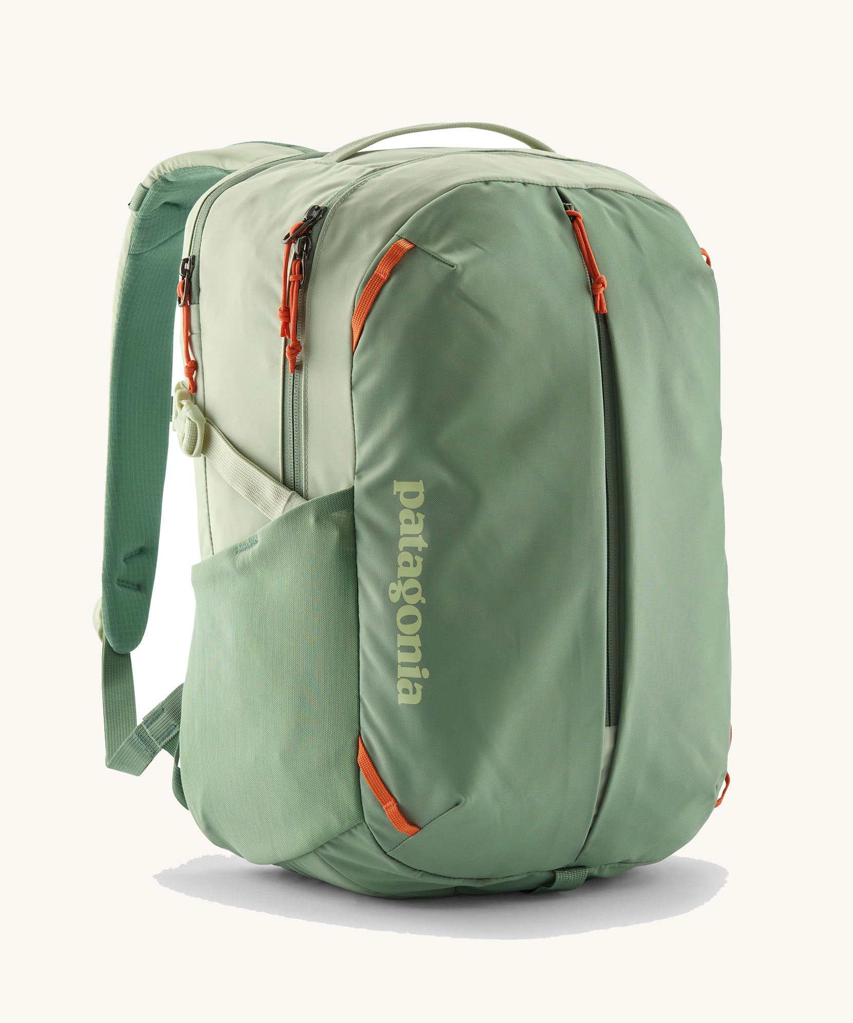 Patagonia refugito day pack 26 litres in lichen green. A 100% recycled material backpack in pastel green with orange detail. Features padded shoulder straps, mesh side pockets and 3 main compartments. 