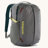 Patagonia refugito day pack 26 litres in noble grey. A 100% recycled material backpack in grey with yellow, green and brwon detail. Features padded shoulder straps, mesh side pockets and 3 main compartments. 