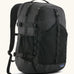 Patagonia 30L refugio backpack in black with side bottle holder and black gear loops and quick release buckles.