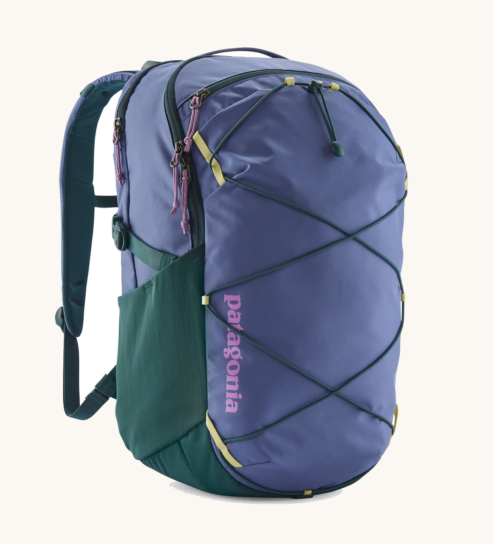 Patagonia refugio 30 litres day pack in current blue. A 100% recycled material backpack in dark blue with dark green, yellow and pink detail. Features padded shoulder pads, mesh side pockets and a bungee cord on the front to keep items secured