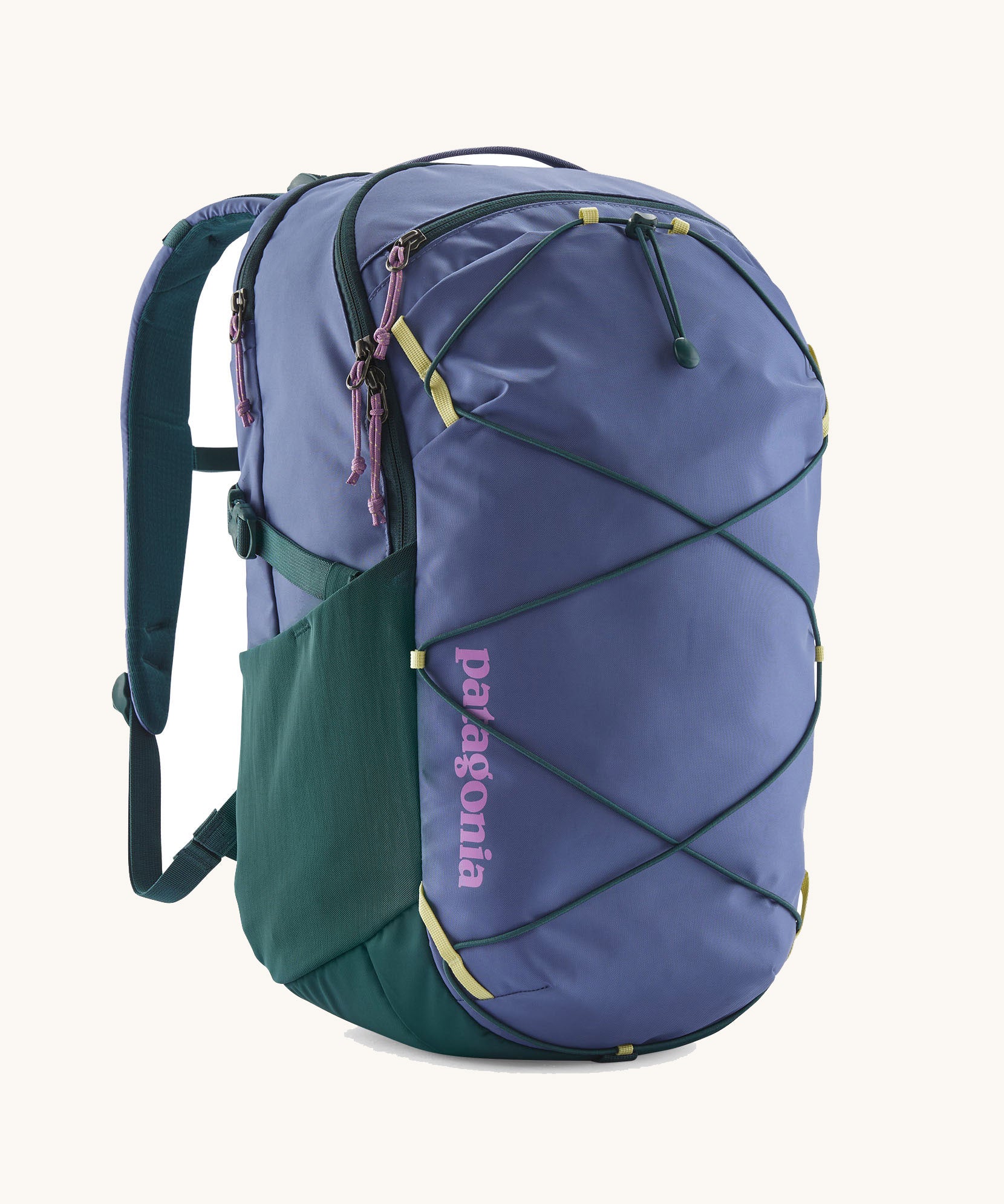 Patagonia refugio 30 litres day pack in current blue. A 100% recycled material backpack in dark blue with dark green, yellow and pink detail. Features padded shoulder pads, mesh side pockets and a bungee cord on the front to keep items secured