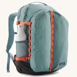 Patagonia refugio 32L daypack in sage blue and orange trim. Shows a water bottle mesh side pockets 