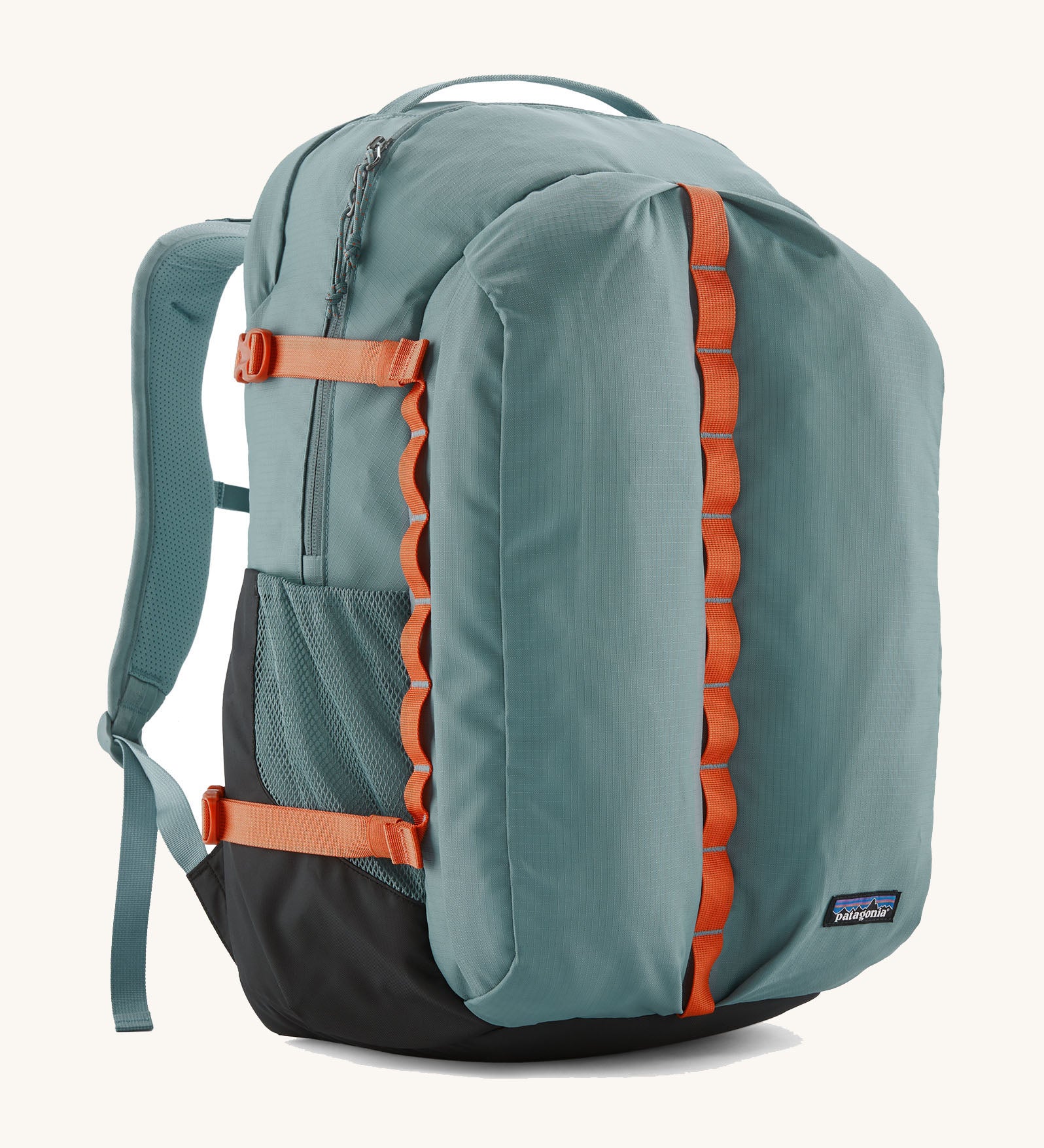 Patagonia refugio 32L daypack in sage blue and orange trim. Shows mesh side pockets and zipped compartment. 