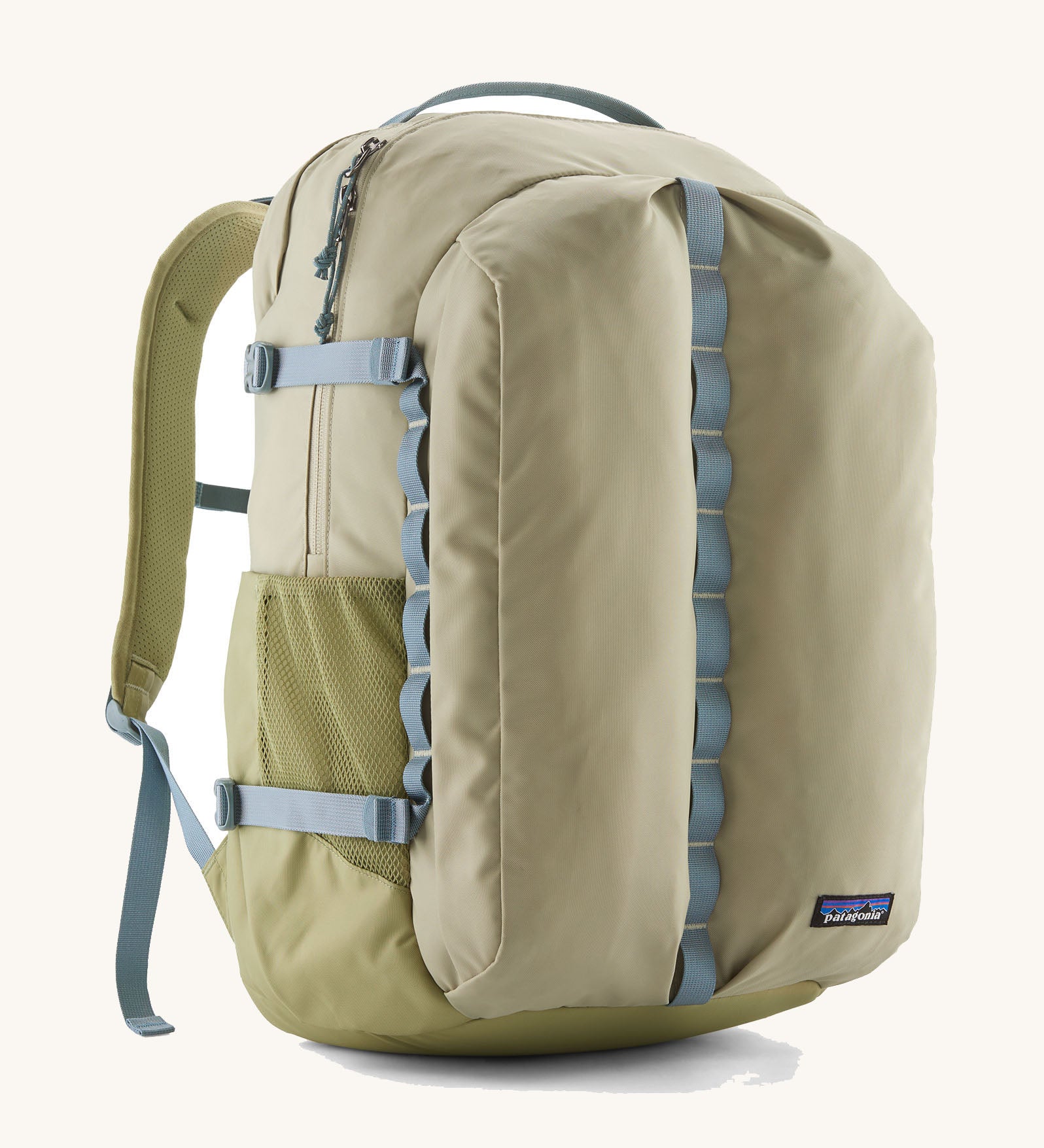 Patagonia refugio 32L daypack in light green and blue trim. Shows mesh side pockets and zipped compartment. 