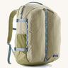 Patagonia refugio 32L daypack in light green and blue trim. Shows mesh side pockets and zipped compartment. 