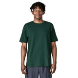 A man wearing the Patagonia men's logo responisbilli tee in cascade green available at Babipur.