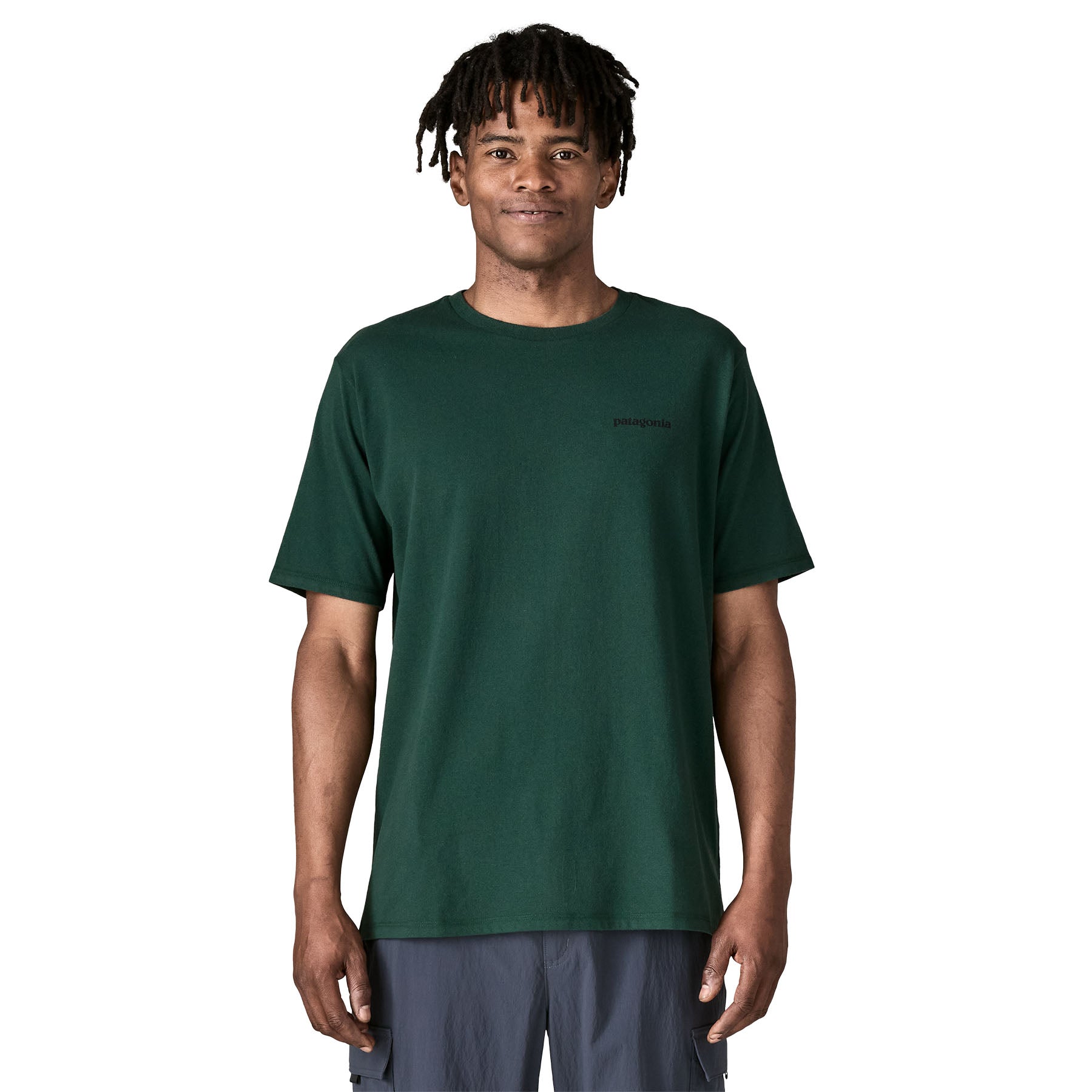 A man wearing the Patagonia men's logo responisbilli tee in cascade green available at Babipur.