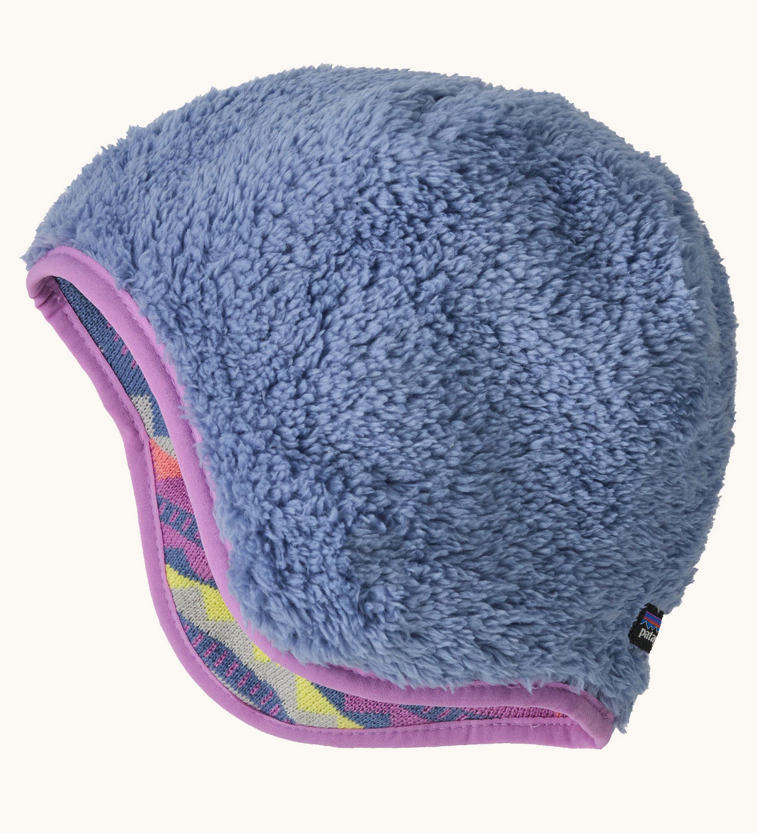 The reversible side of the Patagonia beanie showing the purple cosy fleece fur and light purple trim. Features the logo patch stitched on the back.