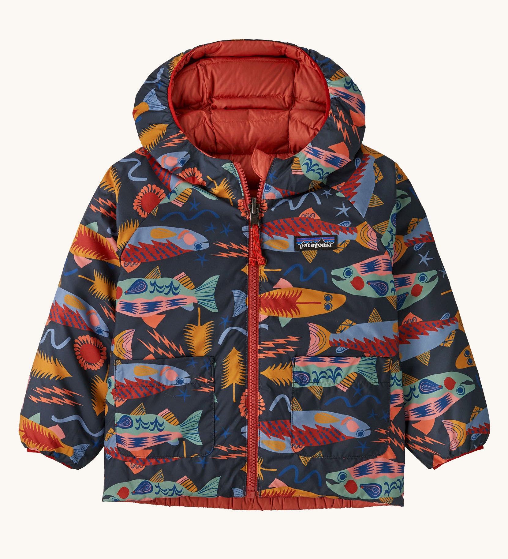 Patagonia little kids down hooded jacket in salmon energy/ink black. A light warm reversible jacket in black with funky salmon prints. Features a a full length zip and 2 side pouch pockets