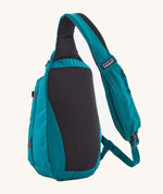 The back of the Patagonia Atom Sling 8L available at Babipur showing the zipped pocket on the shoulder strap