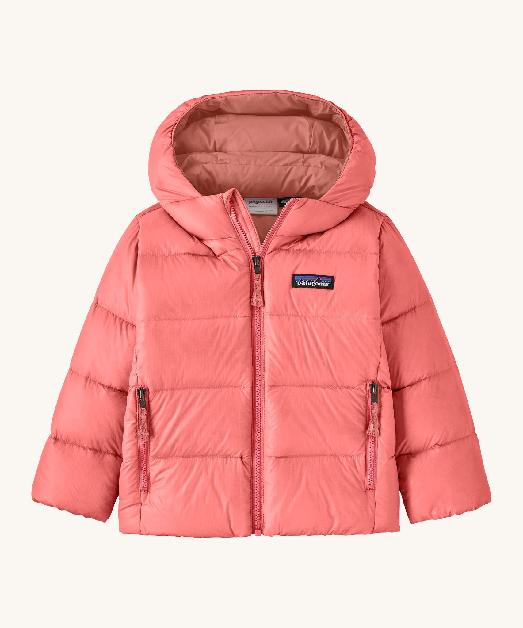 Patagonia little kids hi-loft down sweater hoody jacket in sparkle pink available at Babipur. A warm down hooded jacket in a pink colour. Feeatures a full length zip fastener and side zip pockets