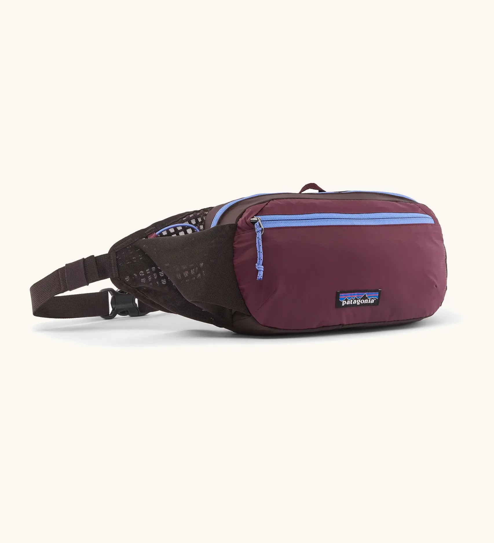 Patagonia terravia hip bag in dark purple with lilac trim. Features 2 zipped compartments and small mesh side pocket