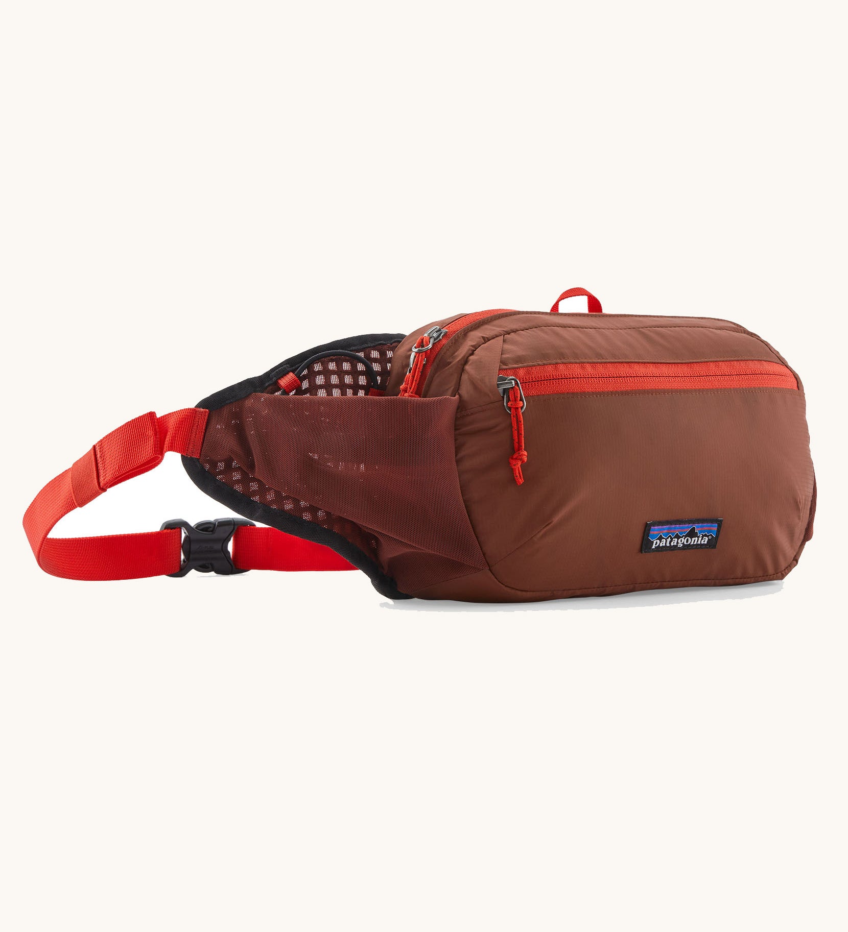 Patagonia terravia 5 litre hip pack. A 100% recycled material hip pack in deep red with bright red detail. Features 2 main compartments, mesh side pockets and a buckle fastener