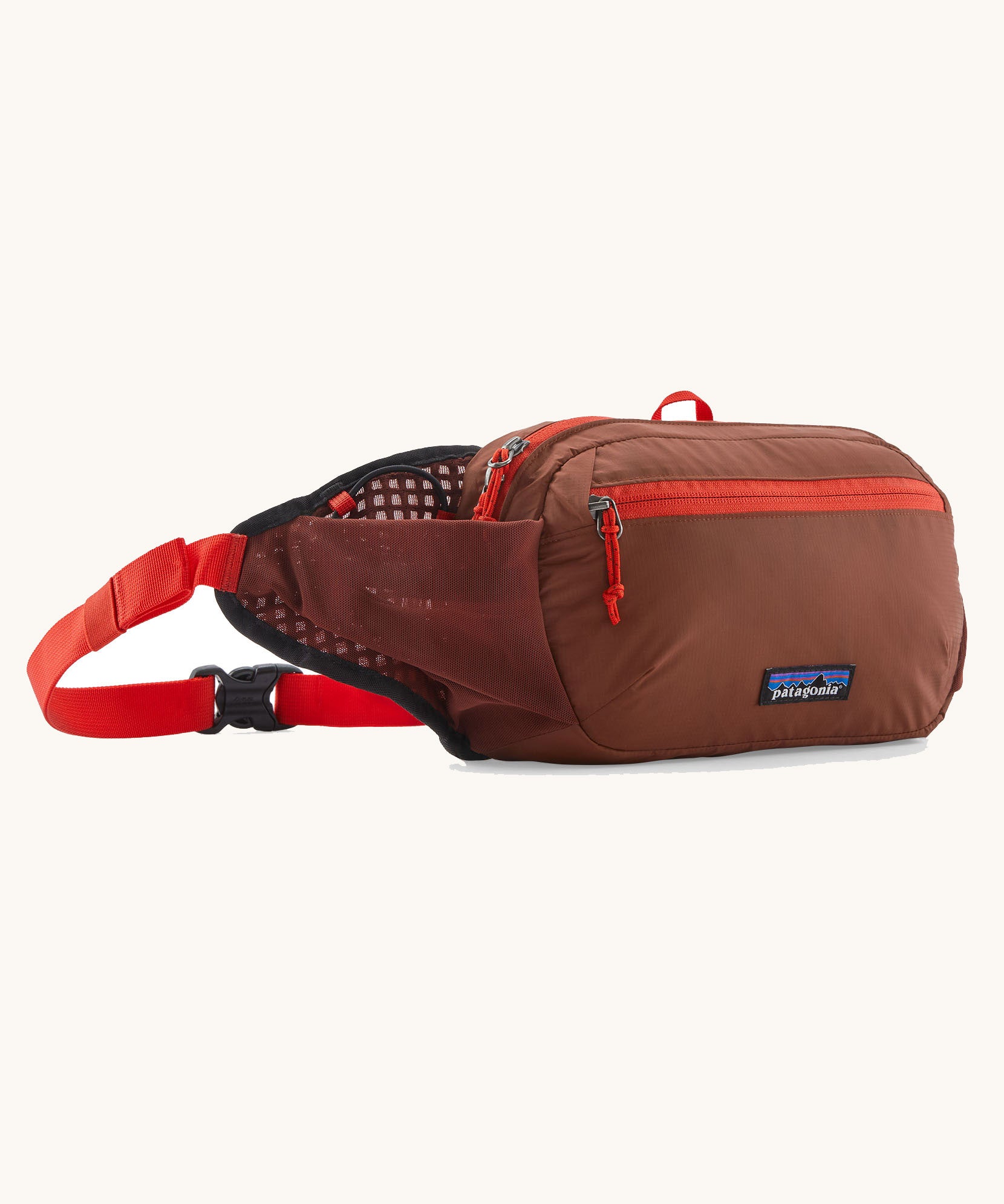 Patagonia terravia 5 litre hip pack. A 100% recycled material hip pack in deep red with bright red detail. Features 2 main compartments, mesh side pockets and a buckle fastener
