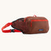 Patagonia terravia 5 litre hip pack. A 100% recycled material hip pack in deep red with bright red detail. Features 2 main compartments, mesh side pockets and a buckle fastener