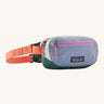 Patagonia terravia mini bum bag in patchwork/barnacle blue available at Babipur. A 100%  recycled material pack in blue and dark green with pink detail. Features 2 main zipped compartments and a buckle fastener on a orange strap