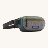 Patagonia terravia mini bum bag in noble grey available at Babipur. A 100%  recycled material pack in grey and dark green with yellow and green detail. Features 2 main zipped compartments and a buckle fastener