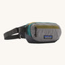 Patagonia terravia mini bum bag in noble grey available at Babipur. A 100%  recycled material pack in grey and dark green with yellow and green detail. Features 2 main zipped compartments and a buckle fastener