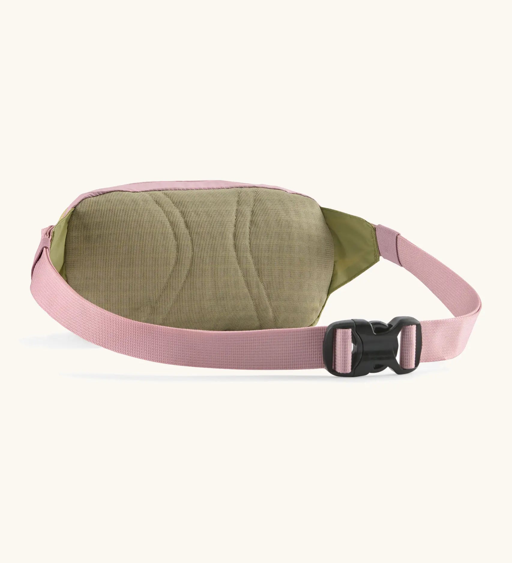Patagonia Terravia Mini Bum Bag Hip pack in pale pink with green back panel showing quick release buckle on the strap