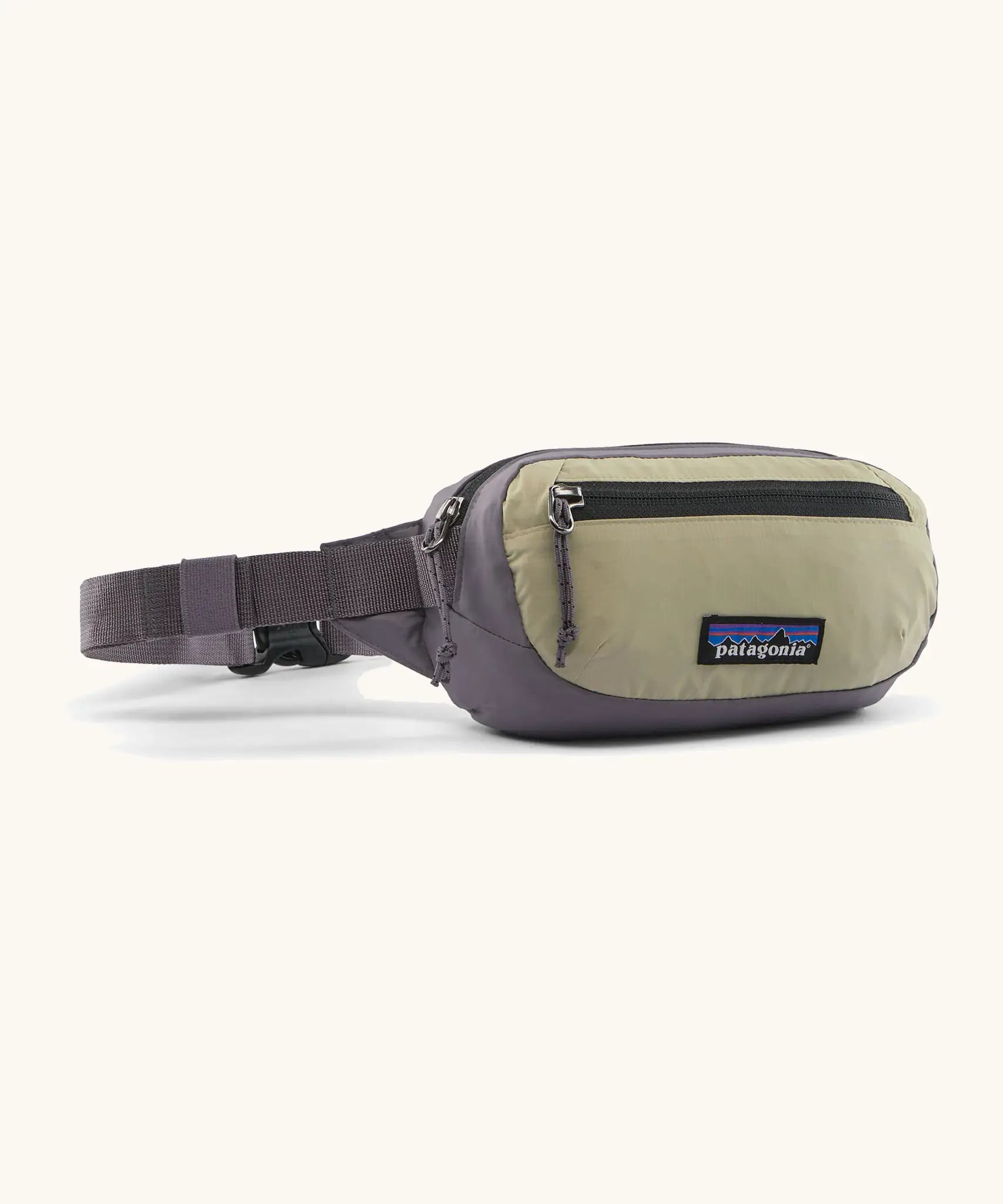 Patagonia 100% recycled nylon weather resistant terravia mini hip pack in grey with beige front panel. Features 2 compartments with black zip detail
