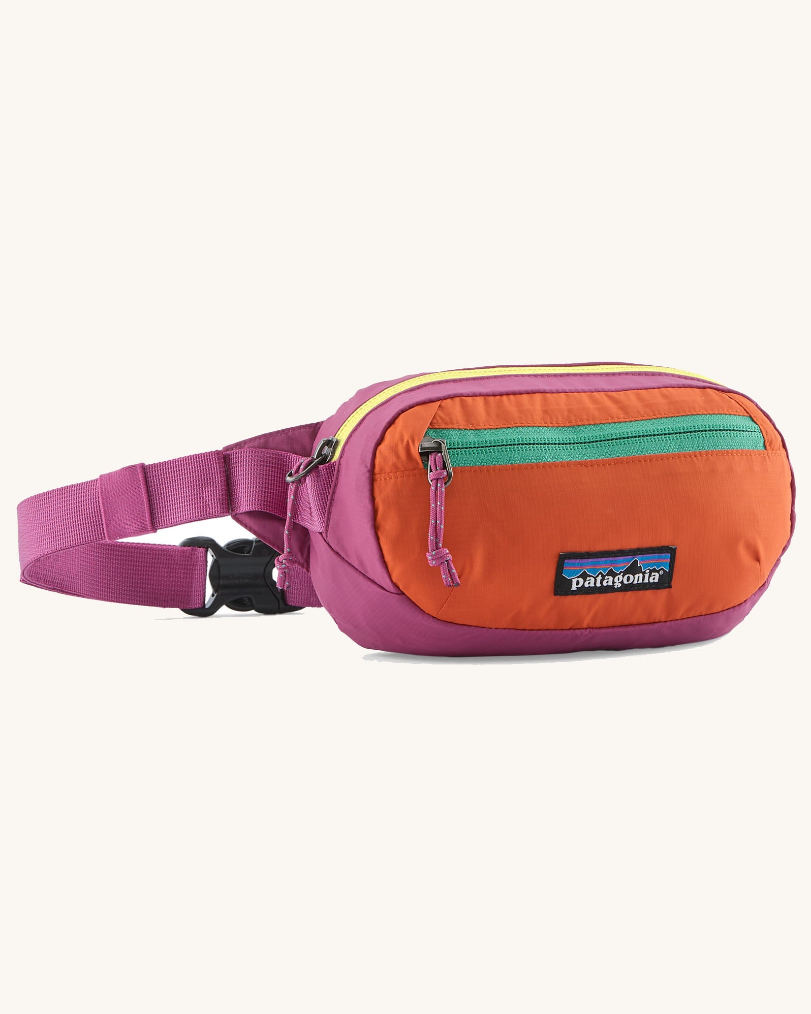 Patagonia weather repellent terravia mini hip pack in pink with orange front . Shows 2 zipped front pockets