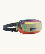 Patagonia weather repellent recycled nylon terravia mini hip pack in navy with green front Shows 2 zipped front pockets