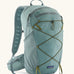 Patagonia terravia 22L backpack in sage blue with zipped compartments and dark green gear elastics on the front. 