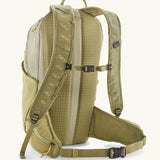 Patagonia terravia 22L backpack in light green with chest and waist straps with black quick release buckles.