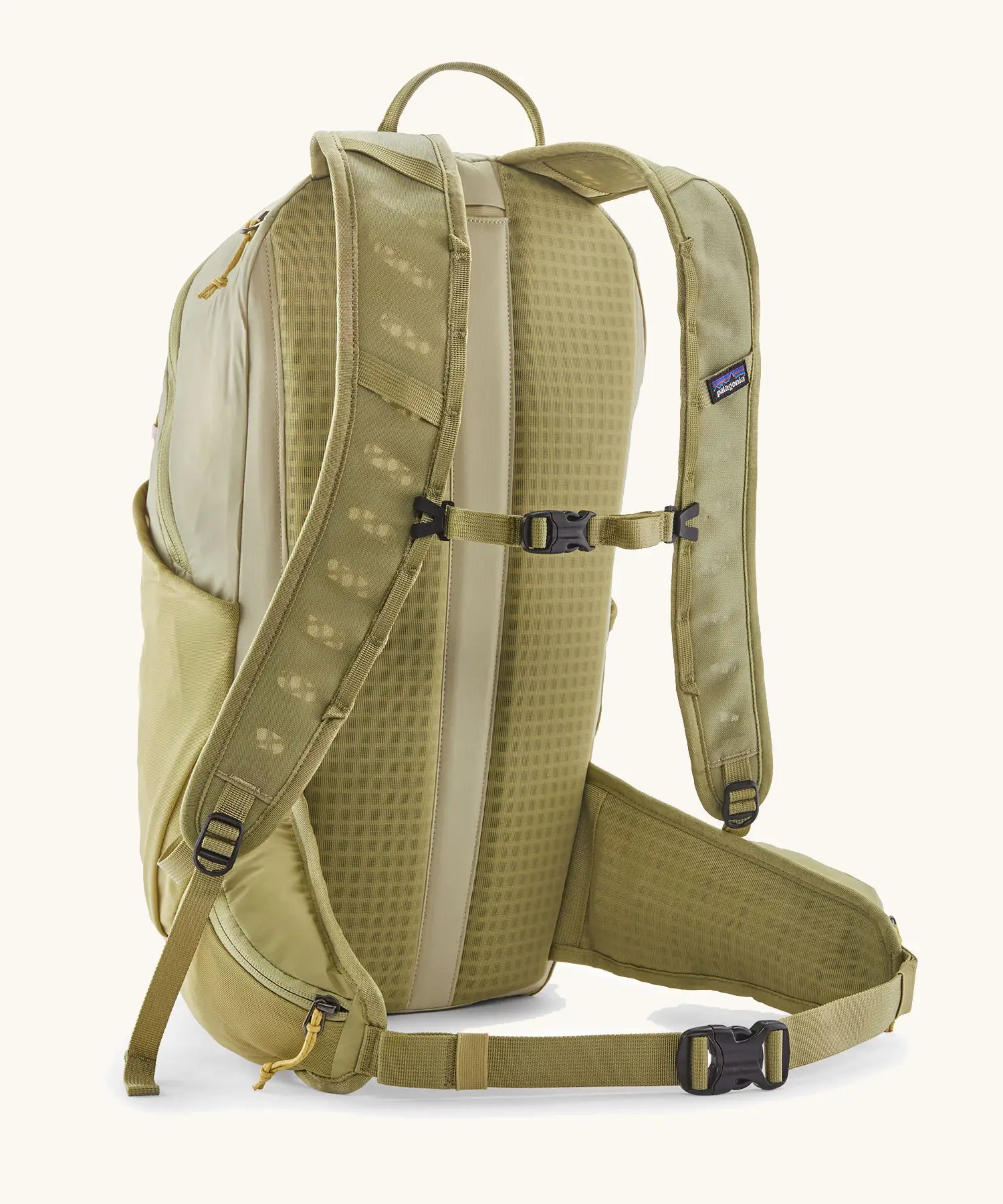 Patagonia terravia 22L backpack in light green with chest and waist straps with black quick release buckles.