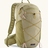 Patagonia terravia 22L backpack in light green with zipped compartments and dark yellow gear elastics on the front. 