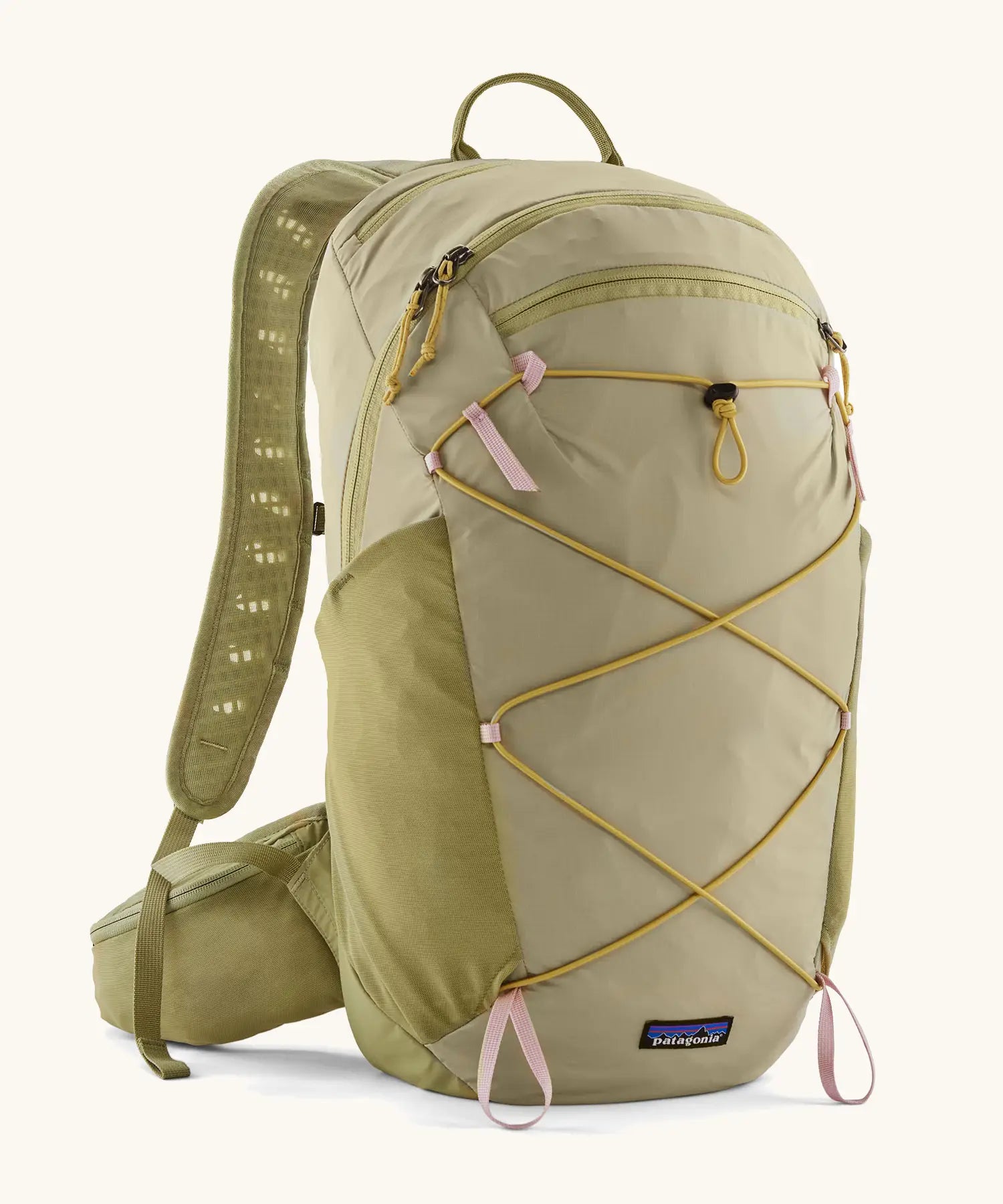 Patagonia terravia 22L backpack in light green with zipped compartments and dark yellow gear elastics on the front. 