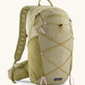 Patagonia terravia 22L backpack in light green with zipped compartments and dark yellow gear elastics on the front. 