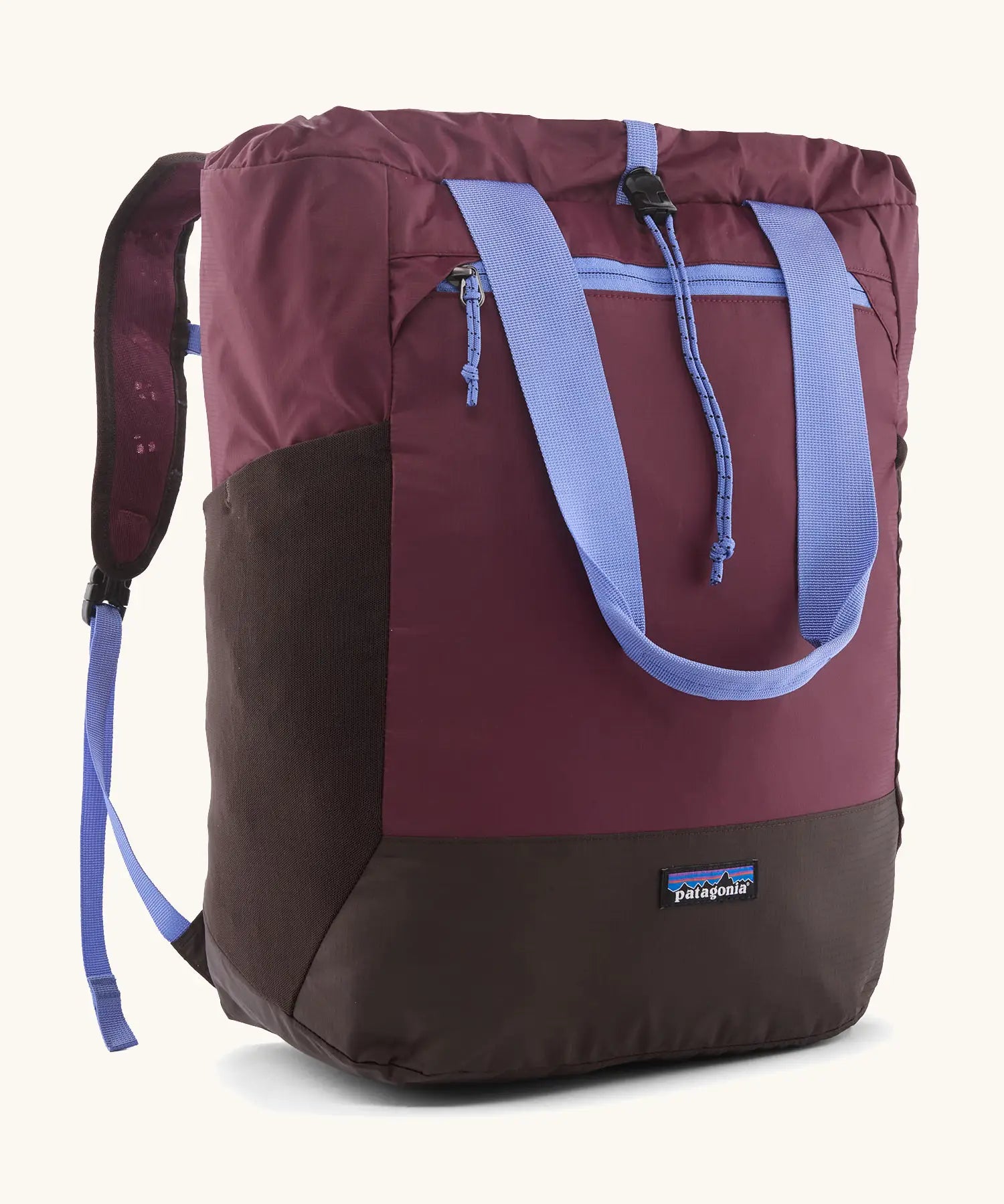 Patagonia water repellent Terravia tote bag in berry with lilac trim. Features a front zip pocket, carry handle, side pockets and shoulder straps 