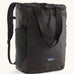 Patagonia water repellent Terravia tote bag in black. Features a front zip pocket, carry handle, side pockets and shoulder straps 