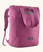 Patagonia terravia tote pack in bright purple with matching carrying handles, straps and a mesh side pocket