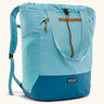 Patagonia water repellent Terravia tote bag in bright blue with a darker blue bottom panel. Features a front zip pocket, carry handle, side pockets and shoulder straps 