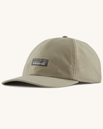 Patagonia recycled fast drying 100% nylon terrebonne cap in light green. Shows a small brand patch on the front