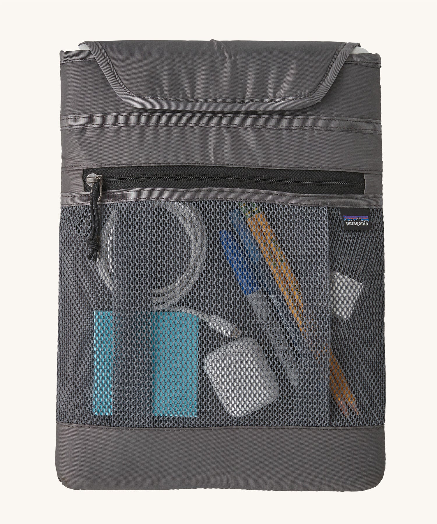 The inside pocket showing objects inside to show how much can be carried