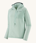 Patagonia hooded lightweight jacket in light turquoise. Features a 3/4 length zip and a zipped check pocket